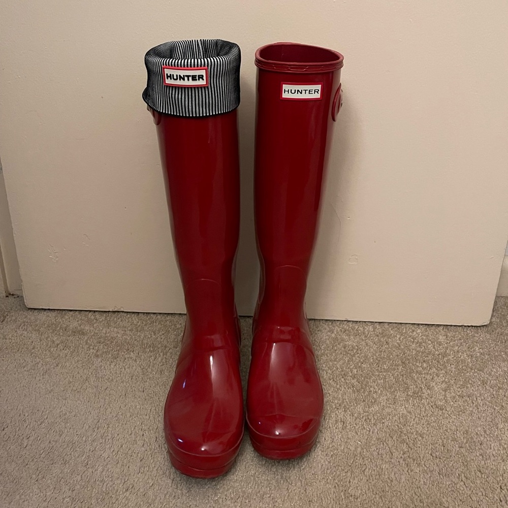 Red tall hunter boots with with hunter socks.